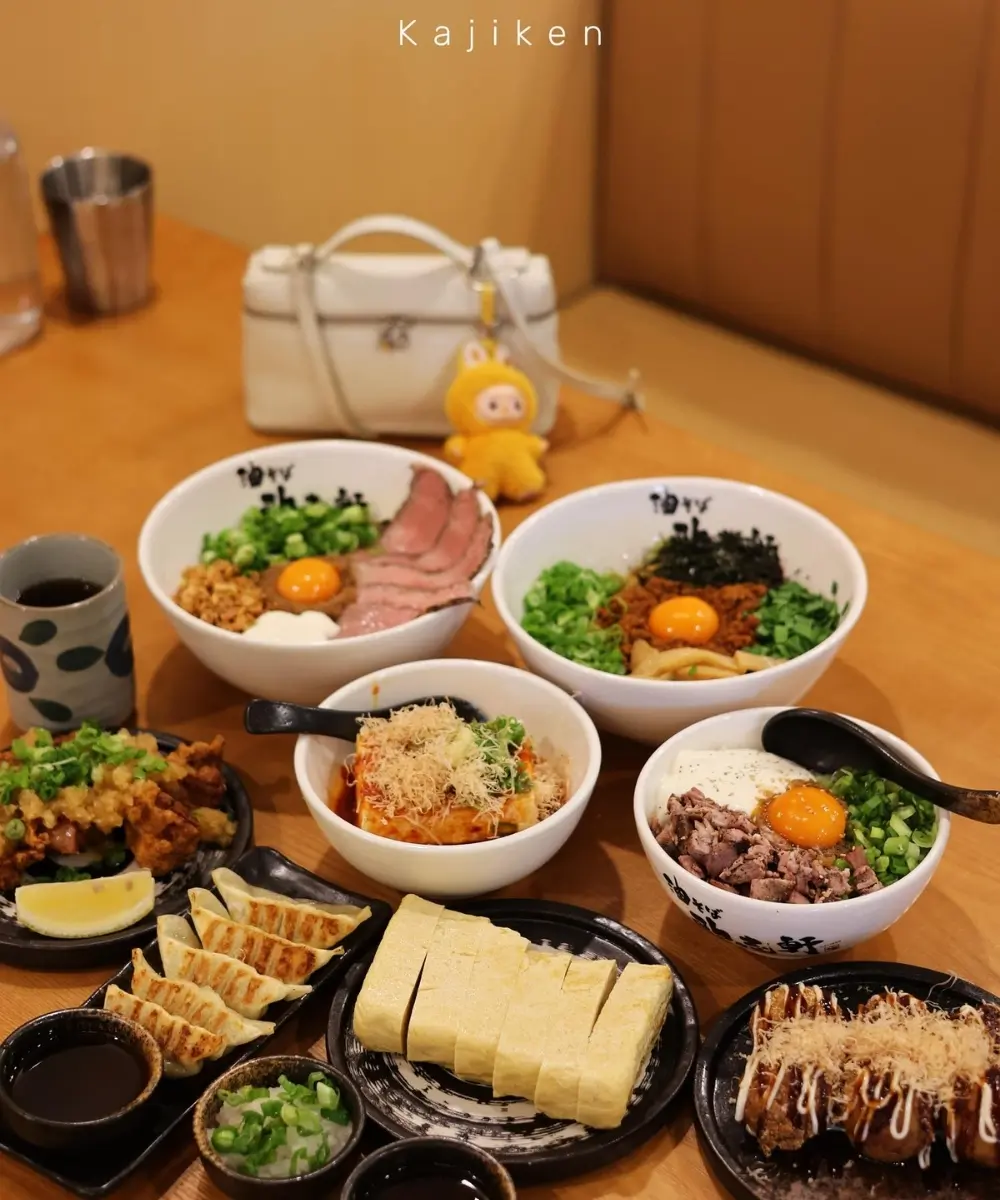 Assorted aburasoba bowls and sides like gyoza at Kajiken-Fullerton, a Japanese Aburasoba Restaurant in Fullerton