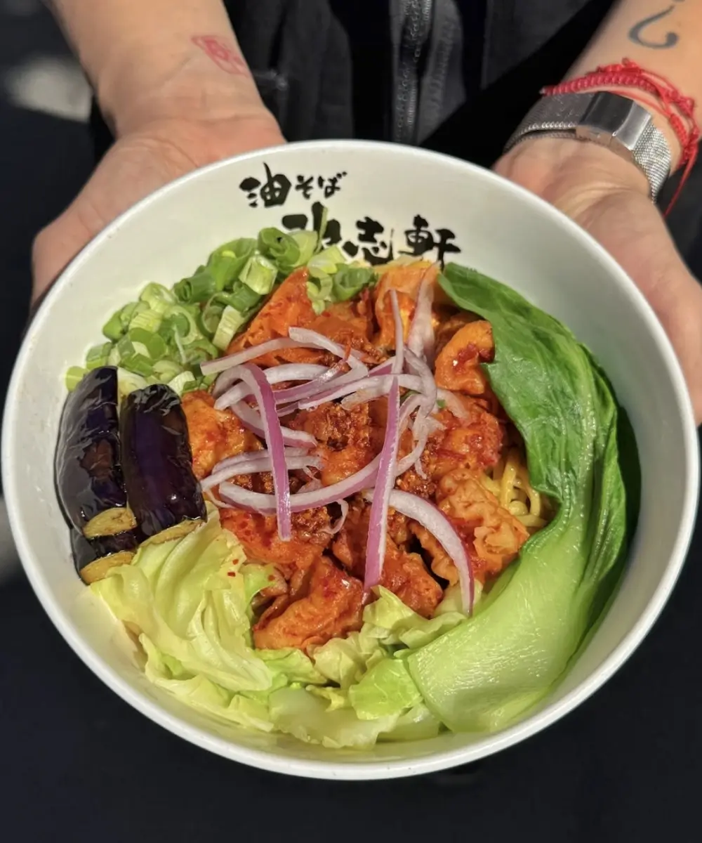 Spicy aburasoba bowl with veggies and onions at Kajiken-Fullerton, a Japanese Aburasoba Restaurant in Fullerton